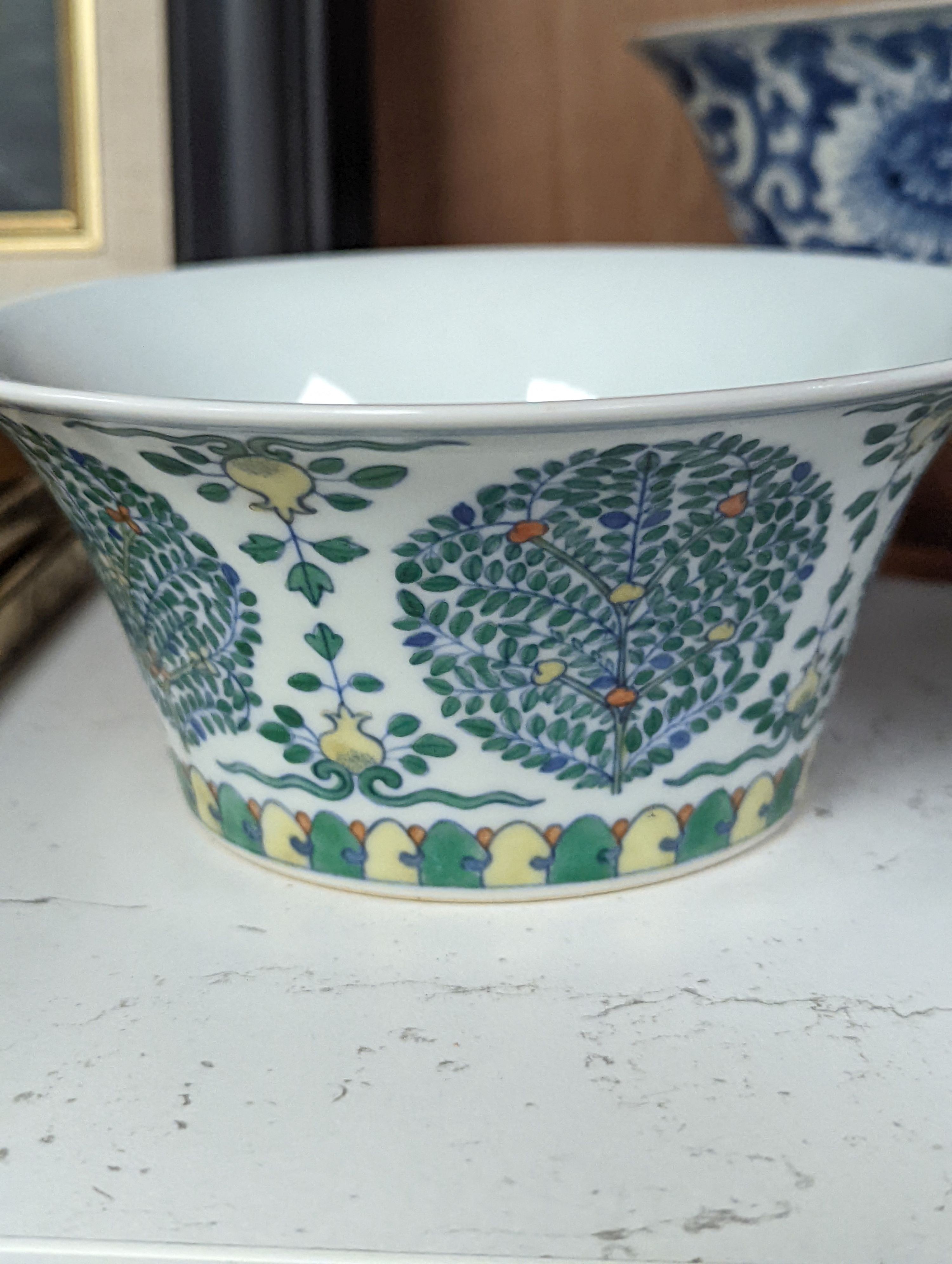 A Chinese blue and white bowl, Kangxi, 15cm. diam., a famille rose teapot stand, Yongzheng, and two doucai bowls